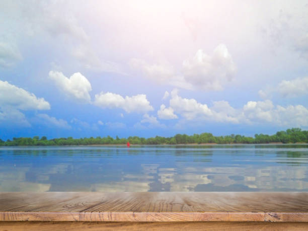 istock clouds are reflected in the river on a quiet, calm summer morning Summer 1033707744