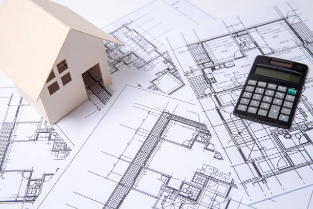 istock heap of design and project drawings on table background. 1033711112