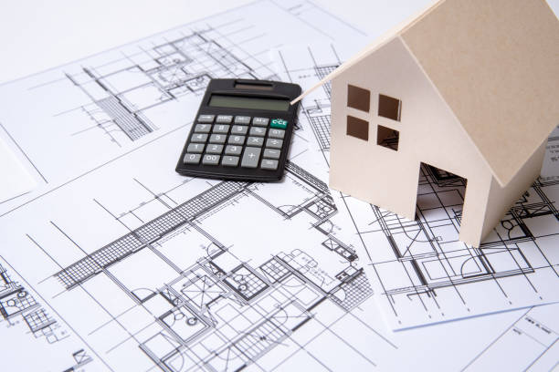 istock heap of design and project drawings on table background. 1033711126