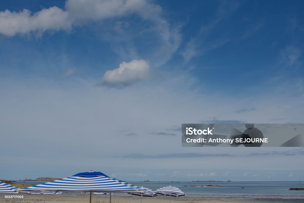 Dinard umbrellas Dinard beach blue and white umbrella Beach Stock Photo