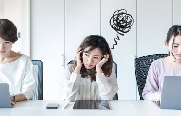 Worrying asian woman in the office. Worrying asian woman in the office. affirmative action photos stock pictures, royalty-free photos & images