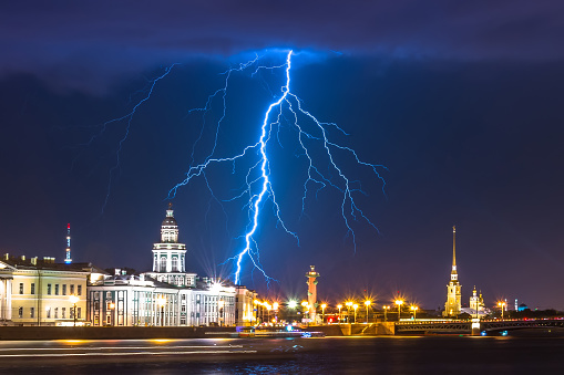 Night with lightning thunderstorm flash over the Neva in Saint-Petersburg and the Kunstkamera, Peter and Paul Fortress and Rostral column
