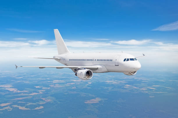 istock Passenger airplane fly on a hight above clouds and blue sky. 1033739438