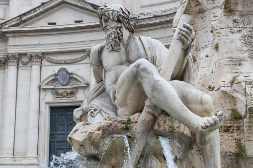 Zeus Statue in Fountain of the Four Rivers in the Piazza Navona (Navona Square) in Rome was designed in 1651 by Gian Lorenzo Bernini. Italy.