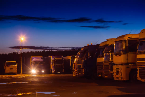 istock Trucks and semi-trailers in the night Parking lot 1033747122