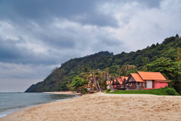 istock Cheap bungalows on a tropical beach 1033747592