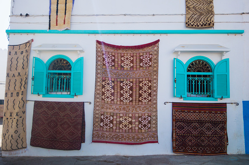 Amazing Moroccan carpets hanging on the facades - Asilah, Morocco