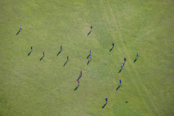 istock people on green field from above 1033765442
