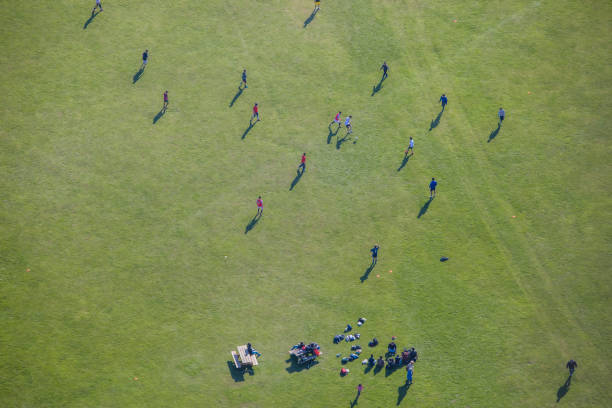 istock people on green field from above 1033765556