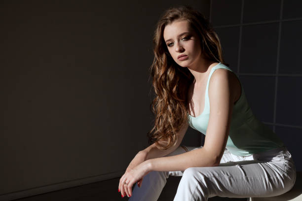 istock beautiful woman portrait on a dark background 1033765808