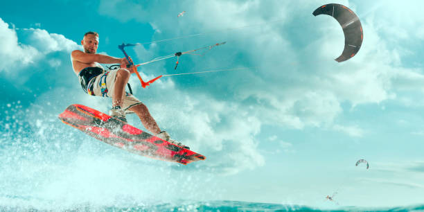 istock Kitesurfing. Man rides a kite 1033768916