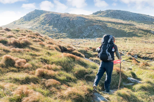 istock Walking through the mountains a tourist 1033769074
