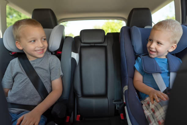 istock Two boys are driving in car seats 1033773988