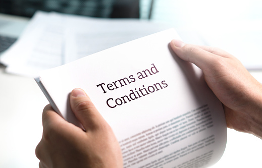 Terms and conditions text in legal agreement or document about service, insurance or loan policy.