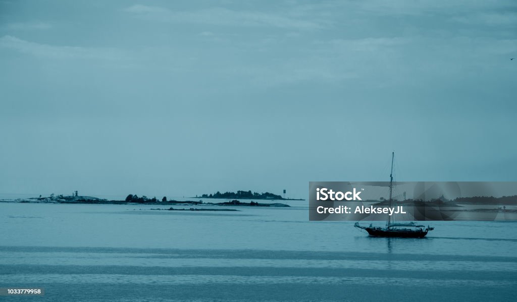 view of the Baltic Sea with islands and sailing ships in the evening Horizontal Stock Photo