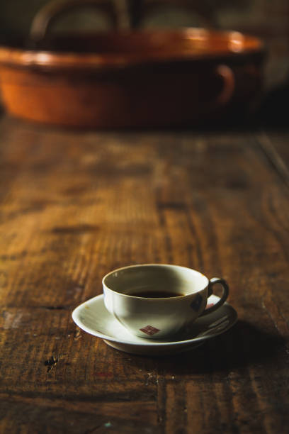 istock Cup of coffee in a wooden table 1033782888