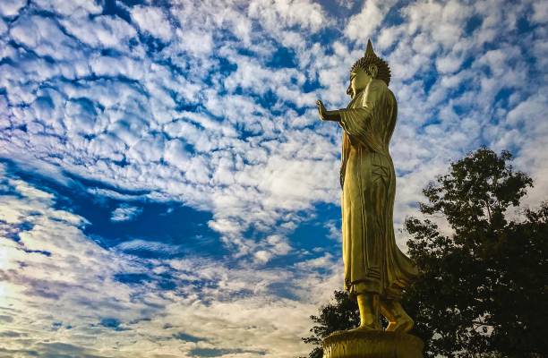 istock Walking Buddha Statue At Wat Phra That khao Noi Temple , Thailand 1033786260