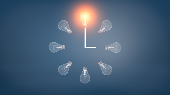 3d rendering of a several incandescent light bulbs arranged in the clock shape with one glowing bulb on the top. Right time. Ideas and innovation. Startup and new business.