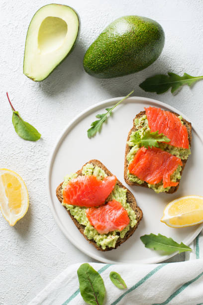 istock Toasts with avocado and salmon on plate 1033795146