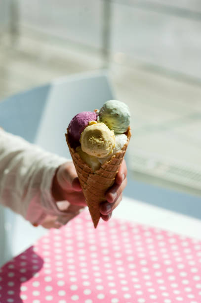 istock young man eats colorful ice cream in a cafe 1033795458