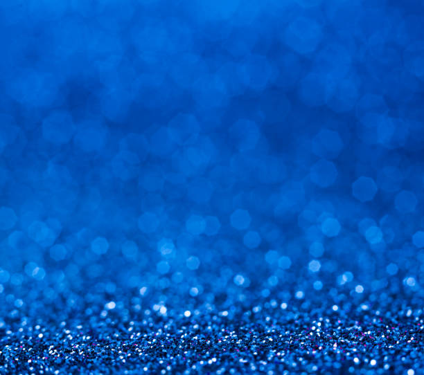 istock Shiny blue abstract christmas background. Blue glitter. 1033802420