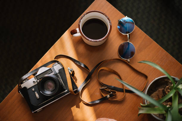 istock Old retro camera on vintage rustic wooden planks boards 1033813472