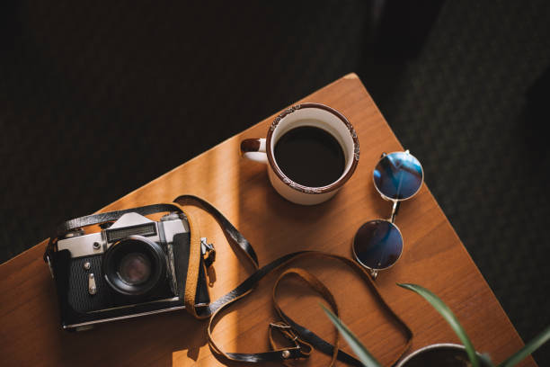istock Retro camera,plant and sunglasses on the table 1033813486