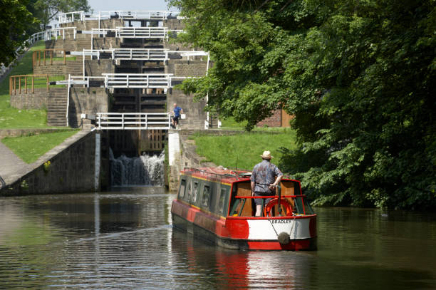 BINGLEY, YORKSHIRE, UK: MARCH 30, 2005: Canal barge on Leeds-Liverpool canal near Five Rise Locks