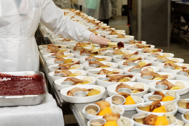 istock Gloved chef is adding berry sauce to airline meals 1033823198