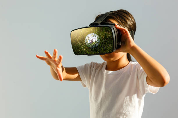 istock Little girl with virtual reality headset. Innovation technology and education concept 1033823290