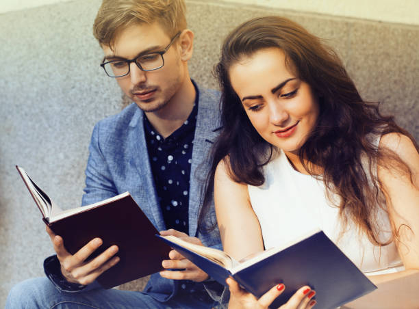 istock Young couple reading books 1033823334