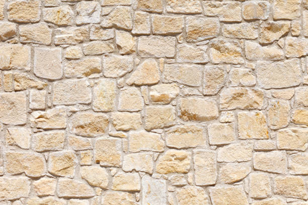 Wall of light, yellow Sandstone. Background image, texture. Wall of light, yellow Sandstone of different shapes and sizes. Background image, texture stone wall stock pictures, royalty-free photos & images
