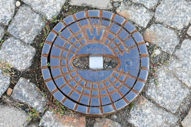 istock manhole on the street 1033829934