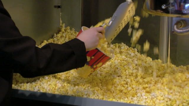Filling up a bucket of popcorn