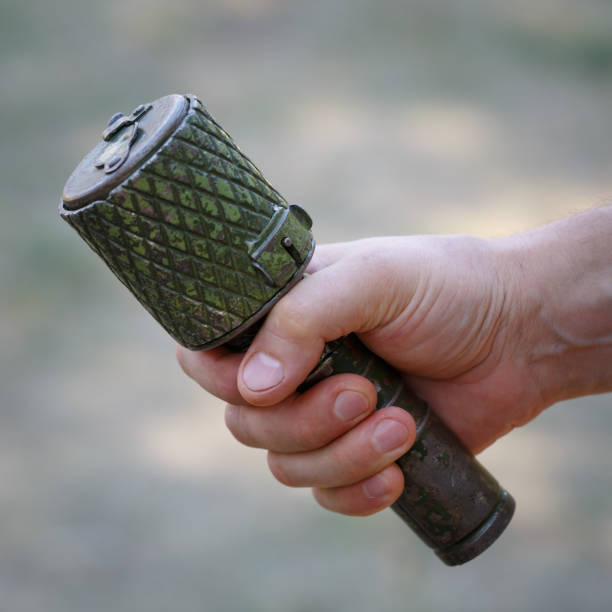 istock Antitank grenade in the male hand close-up 1033839490