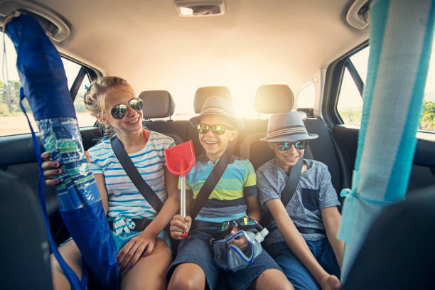 istock Kids going to beach by car 1033842300