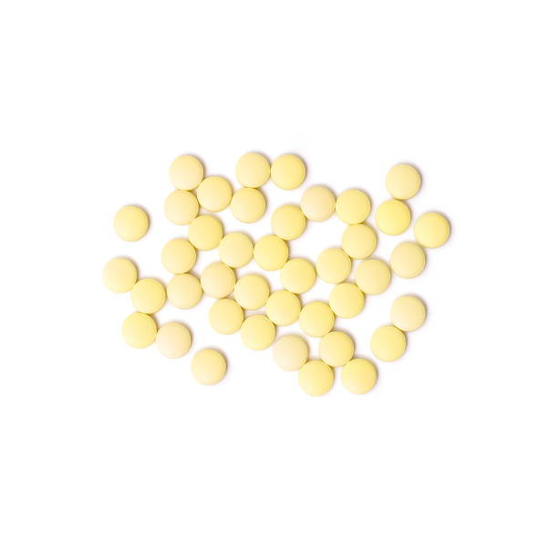 istock Medicine white and yellow pills or capsules 1033842782