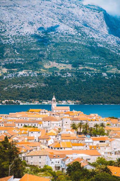 Town of Korcula, Dalmatia, Croatia Beautiful view of the historic town of Korcula on a beautiful sunny day with blue sky and clouds in summer, Island of Korcula, Dalmatia, Croatia dubrovnik walls stock pictures, royalty-free photos & images