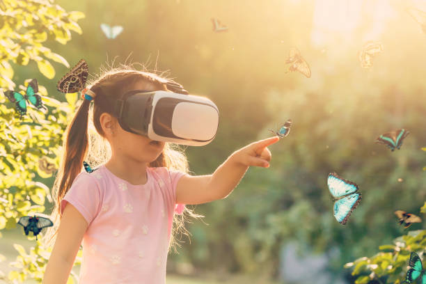 istock Excited siblings using virtual reality headset and looking at butterflies 1033847176