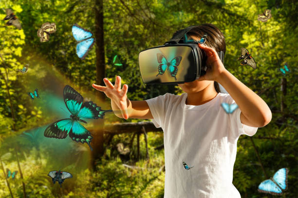 istock Excited siblings using virtual reality headset and looking at butterflies 1033847256