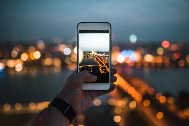 istock Taking a picture at night with a modern mobile phone 1033855798