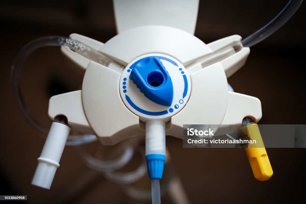 Drip stand organiser for Peritoneal dialysis. Drip stand organiser for Peritoneal dialysis, with dial switched to the fluid in position. Dialysis Stock Photo