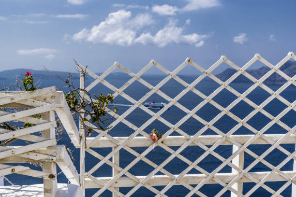Decorative wooden fence of a small house on the Mediterranean coast on the island of Santorini