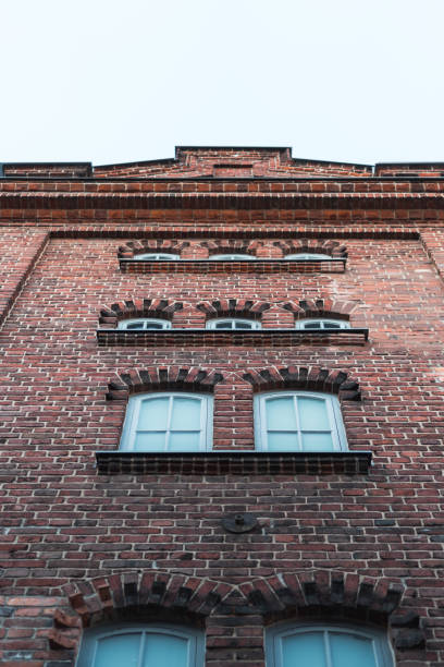 istock Loft styled old brick house from street level 1033865186