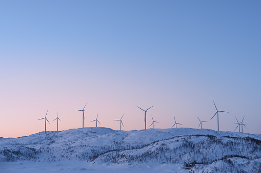 View at the wind turbines farm in Norway in winter. Wind power engineering in Scandinavian countries.