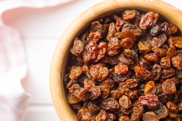 Sweet dried raisins Sweet dried raisins. Top view. raisin stock pictures, royalty-free photos & images