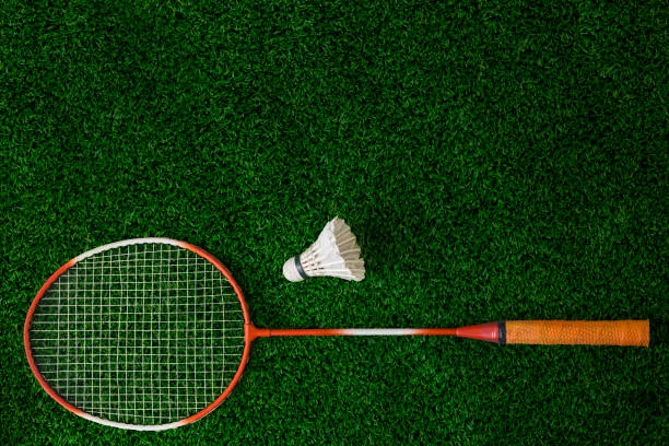 istock Badminton Rackets And Shuttlecock on grass 1033878450