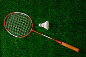 Badminton Rackets And Shuttlecock on grass