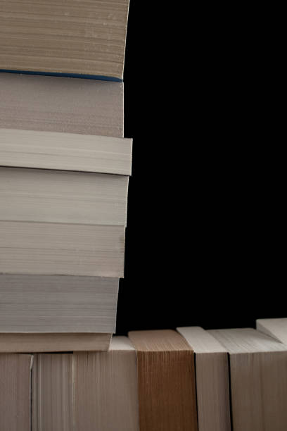 istock Stack of old books background. Many books piled together. Education and wisdom concept. 1033886102