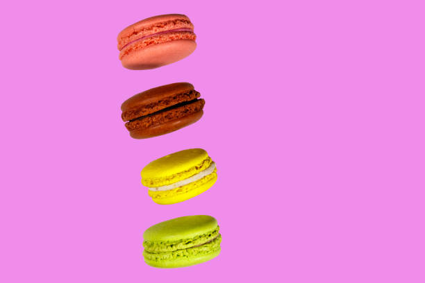 istock Tasty colorful macaroons on pink background 1033886728